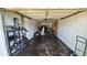 Attached garage space showing interior with empty walls and damaged ceiling at 1107 Goshen Rd, Tarpon Springs, FL 34689