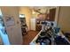 A kitchen featuring wood cabinets, a white refrigerator, and a double basin sink under a ceiling fan at 1107 Goshen Rd, Tarpon Springs, FL 34689