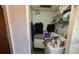 Compact laundry area with washer, dryer, and shelving for storage at 1107 Goshen Rd, Tarpon Springs, FL 34689