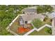 Spacious fenced backyard with a screened lanai, playground set, and ample space for outdoor activities at 11123 Silver Dancer Dr, Riverview, FL 33579