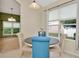 Cozy breakfast nook featuring blue and beige chairs and window views at 11123 Silver Dancer Dr, Riverview, FL 33579