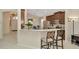 Stylish kitchen featuring granite countertops, stainless steel appliances, and a breakfast bar with seating at 11123 Silver Dancer Dr, Riverview, FL 33579