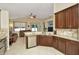 Well-equipped kitchen with granite counters, stainless appliances, and a breakfast bar overlooking the living area at 11123 Silver Dancer Dr, Riverview, FL 33579