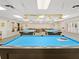 The community's billiard room boasts two full-sized pool tables, pendant lighting and seating at 11334 Winwood Pl # 11334, Port Richey, FL 34668