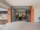 Grand entrance to the clubhouse with decorative iron gates and a view into the interior spaces at 11334 Winwood Pl # 11334, Port Richey, FL 34668