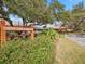 A view of the 'Timber Oaks Clubhouse' sign surrounded by landscaping, with the clubhouse in the background at 11334 Winwood Pl # 11334, Port Richey, FL 34668