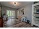 Inviting dining area with a small table set, sliding glass doors and wooden-style flooring at 11334 Winwood Pl # 11334, Port Richey, FL 34668