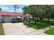 Lovely single story home with two car garage, tile roof, arched entry and well-maintained landscaping at 11334 Winwood Pl # 11334, Port Richey, FL 34668