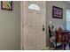 Interior shot of a white front door with decorative glass panel and an umbrella stand at 11334 Winwood Pl # 11334, Port Richey, FL 34668