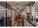 Bright kitchen with stainless steel appliances, modern cabinets, and hardwood floors at 11334 Winwood Pl # 11334, Port Richey, FL 34668