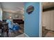 Cozy living room view leading into the bathroom, featuring hardwood floors and comfortable seating at 11334 Winwood Pl # 11334, Port Richey, FL 34668