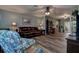 Cozy living room with hardwood floors, comfortable seating, and neutral color palette at 11334 Winwood Pl # 11334, Port Richey, FL 34668