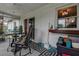 Relaxing screened patio perfect for outdoor dining and lounging with decorative patterned flooring at 11334 Winwood Pl # 11334, Port Richey, FL 34668