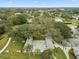 Aerial view of community shuffleboard courts surrounded by mature landscaping and trees at 11334 Winwood Pl # 11334, Port Richey, FL 34668