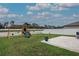Backyard features a playground set, patio and green grass, creating a fun outdoor space at 11693 Lavender Loop, Spring Hill, FL 34609
