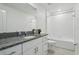 Clean bathroom with granite countertops, white cabinets, and a tiled shower and tub combination at 11693 Lavender Loop, Spring Hill, FL 34609