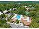 Aerial view of community amenities including a pool and tennis courts at 11805 Raintree Lake Ln # A, Tampa, FL 33617
