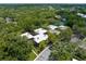 Community aerial featuring lush green landscaping, tennis courts, and parking at 11805 Raintree Lake Ln # A, Tampa, FL 33617
