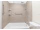 Bathroom features a tiled shower with grab bars at 11805 Raintree Lake Ln # A, Tampa, FL 33617