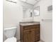Well-lit half bath includes a granite vanity, toilet, and medicine cabinet at 11805 Raintree Lake Ln # A, Tampa, FL 33617