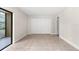 This bedroom features a large closet and sliding glass doors at 11805 Raintree Lake Ln # A, Tampa, FL 33617