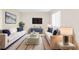 Bright living room featuring two sofas with navy pillows, complemented by a stylish glass coffee table at 11805 Raintree Lake Ln # A, Tampa, FL 33617