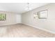 Bright living room with neutral walls, tile floor, and ample natural light at 11805 Raintree Lake Ln # A, Tampa, FL 33617