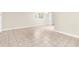 Neutral living room with tile floors, bright windows, and neutral color scheme at 11805 Raintree Lake Ln # A, Tampa, FL 33617