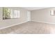 Large living area featuring tile flooring, bright natural light, and neutral color palette at 11805 Raintree Lake Ln # A, Tampa, FL 33617