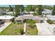 Aerial view of a well-maintained home with verdant landscaping in a quiet neighborhood at 1305 Marion S Dr, St Petersburg, FL 33707