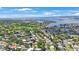 Expansive aerial view capturing the community, lush landscaping, and scenic waterfront at 1305 Marion S Dr, St Petersburg, FL 33707