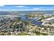 Breathtaking aerial view showcasing a charming neighborhood, a serene marina, and stunning waterfront vistas at 1305 Marion S Dr, St Petersburg, FL 33707
