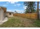 Backyard area showing the wooden fence, lawn, and exterior of the home, with potential for recreation at 1305 Marion S Dr, St Petersburg, FL 33707