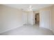 Bright bedroom featuring neutral walls, white trim, and a ceiling fan with integrated lighting at 1305 Marion S Dr, St Petersburg, FL 33707