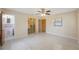 Spacious bedroom with ceiling fan, closet with mirrored door, and view of the en-suite bathroom at 1305 Marion S Dr, St Petersburg, FL 33707