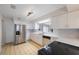 Modern kitchen with white cabinets, subway tile backsplash, and stainless steel appliances at 1305 Marion S Dr, St Petersburg, FL 33707
