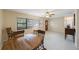 Bright living room with dining area, speckled floors, neutral walls, and front door at 1305 Marion S Dr, St Petersburg, FL 33707