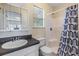 Clean bathroom with a shower, and a large mirror over the sink, offering functionality and style at 1511 East Emma St. E St, Tampa, FL 33610