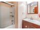 Bathroom features a shower with glass door and vanity with wood cabinets at 1511 East Emma St. E St, Tampa, FL 33610