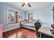 Well-lit bedroom with hardwood floors, large windows, and a cozy daybed at 1511 East Emma St. E St, Tampa, FL 33610
