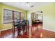 Dining room with hardwood floors, and large windows allowing natural light at 1511 East Emma St. E St, Tampa, FL 33610