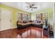 Spacious living room with hardwood floors, large windows, and sectional sofa at 1511 East Emma St. E St, Tampa, FL 33610
