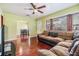 Cozy living room with hardwood floors, ceiling fan and comfortable sectional sofa at 1511 East Emma St. E St, Tampa, FL 33610