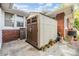 Exterior shot of yard shed with neutral colors and surrounded by plants at 1511 East Emma St. E St, Tampa, FL 33610