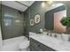 Stylish bathroom featuring modern fixtures, a tub, and a marble countertop vanity at 1558 Cottonwood Ter, Dunedin, FL 34698