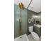 Elegant bathroom featuring modern fixtures, a tub, and a marble countertop vanity at 1558 Cottonwood Ter, Dunedin, FL 34698