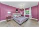 Charming bedroom with hardwood floors, chandelier, and elegant decor at 1558 Cottonwood Ter, Dunedin, FL 34698