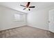 Bedroom featuring a ceiling fan, carpet floors and a window allowing for natural light at 16314 Parkstone Palms Ct, Tampa, FL 33647