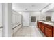 Bathroom with double sinks, granite countertop, and shower with patterned curtain at 17136 Sunshine Mimosa: St, Wimauma, FL 33598