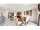 Open concept dining area flows into the kitchen with an island, and stainless steel appliances and into the living area at 17136 Sunshine Mimosa: St, Wimauma, FL 33598